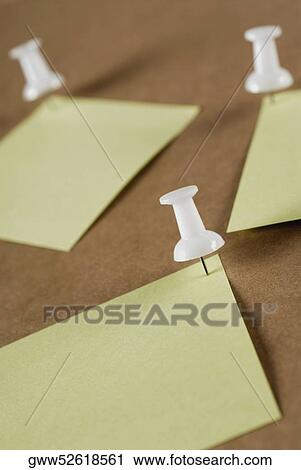 Close-up of thumbtacks on sheets of paper View Large Photo Image Stock Image - Close-up of thumbtacks on sheets of paper. Fotosearch