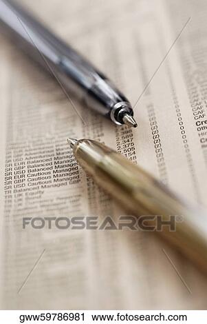 Close-up of two ballpoint pens on stock market data View Large Photo Image Stock Image - Close-up of two ballpoint pens on stock market data. Fotosearch