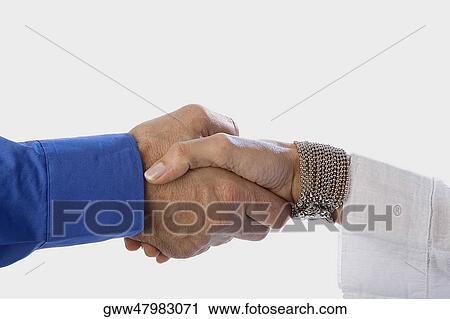 Close-up of two people's hand shaking View Large Photo Image Stock Image - Close-up of two people's hand shaking. Fotosearch