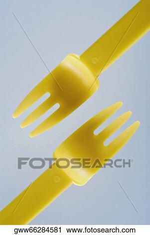 Stock Image - Close-up of two plastic forks. Fotosearch