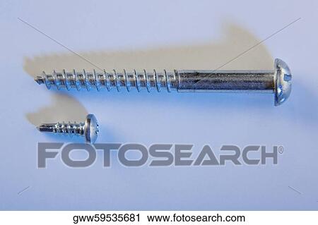 Stock Image - Close-up of two screws. Fotosearch