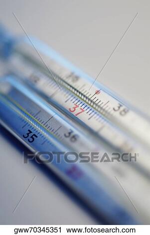 Close-up of two thermometers View Large Photo Image Stock Image - Close-up of two thermometers. Fotosearch