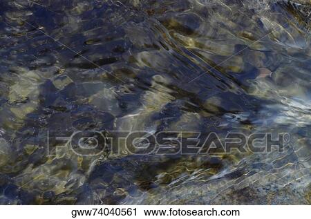 Close-up of water on rocks View Large Photo Image Stock Image - Close-up of water on rocks. Fotosearch