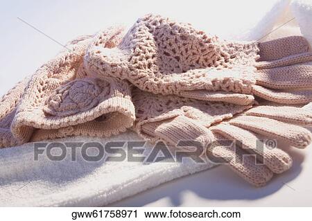 Stock Image - Close-up of woolen gloves on a towel. Fotosearch