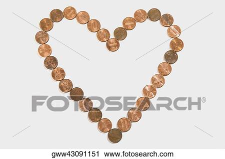 Coins arranged in a heart shape View Large Photo Image Stock Image - Coins arranged in a heart shape. Fotosearch