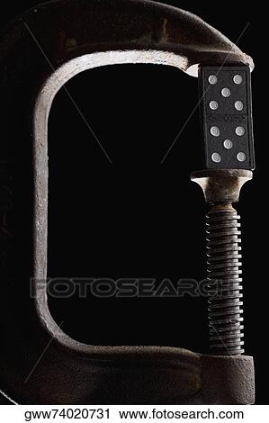 Dice between the jaws of a clamp View Large Photo Image Stock Image - Dice between the jaws of a clamp. Fotosearch