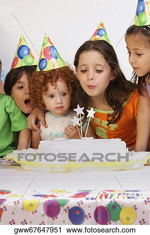 Group of children celebrating a birthday party View Large Photo Image Stock Image - Group of children celebrating a birthday party. Fotosearch