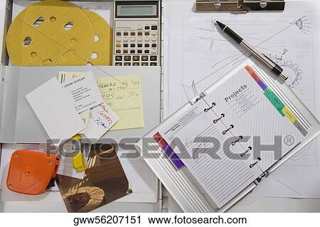 High angle view of a diary with a calculator on the table View Large Photo Image Stock Image - High angle view of a diary with a calculator on the table. Fotosearch