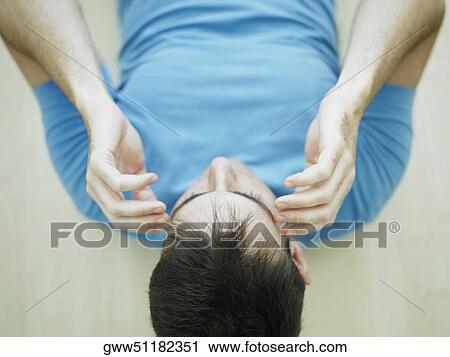 High angle view of a mid adult man exercising View Large Photo Image Stock Image - High angle view of a mid adult man exercising. Fotosearch