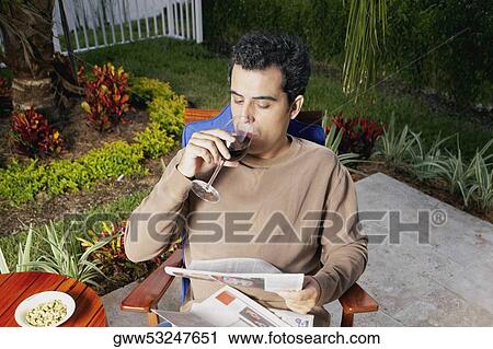 High angle view of a mid adult man sitting and drinking wine View Large Photo Image Stock Image - High angle view of a mid adult man sitting and drinking wine. Fotosearch