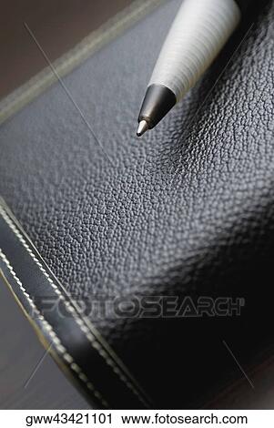 High angle view of a pen on a diary View Large Photo Image Stock Image - High angle view of a pen on a diary. Fotosearch
