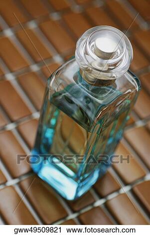 Stock Image - High angle view of a perfume bottle. Fotosearch