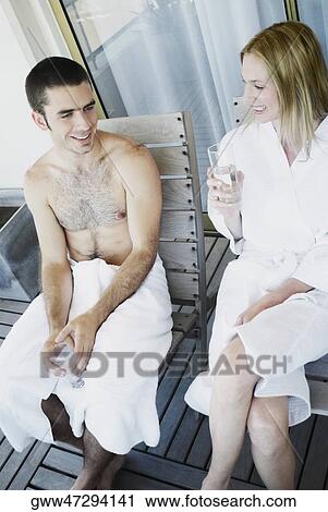 High angle view of a young couple sitting on chairs View Large Photo Image Stock Image - High angle view of a young couple sitting on chairs. Fotosearch