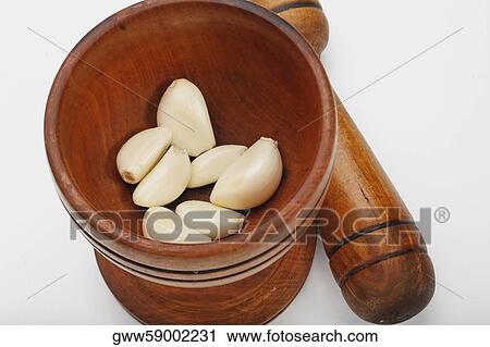High angle view of cloves of garlic in a mortar View Large Photo Image Stock Image - High angle view of cloves of garlic in a mortar. Fotosearch