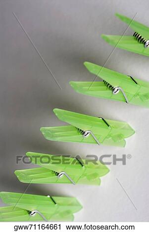 High angle view of five clothespins in a row View Large Photo Image Stock Image - High angle view of five clothespins in a row. Fotosearch
