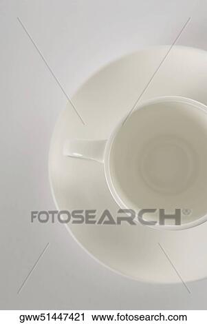 High angle view of tea cup on a saucer View Large Photo Image Stock Image - High angle view of tea cup on a saucer. Fotosearch