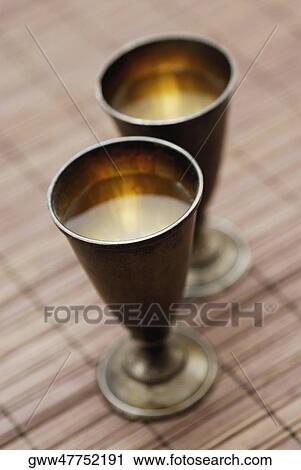 High angle view of two metal glasses View Large Photo Image Stock Image - High angle view of two metal glasses. Fotosearch