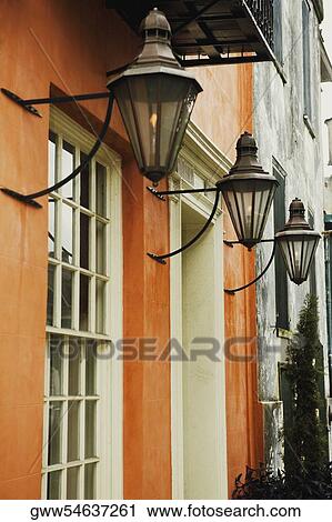 Stock Image - Lantern hanging outside a building. Fotosearch