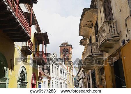 Stock Image - Low angle view of apartments along the street. Fotosearch