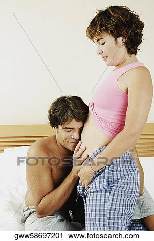 Mature man touching the abdomen of a mature woman View Large Photo Image Stock Image - Mature man touching the abdomen of a mature woman. Fotosearch