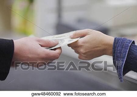 People's hands exchanging paper currency View Large Photo Image Stock Image - People's hands exchanging paper currency. Fotosearch