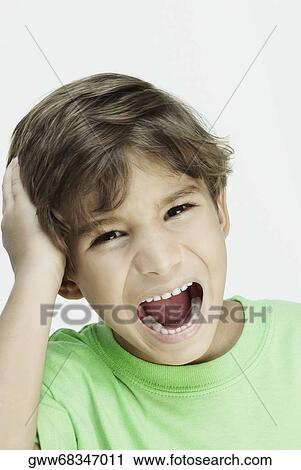 Stock Image - Portrait of a boy crying. Fotosearch