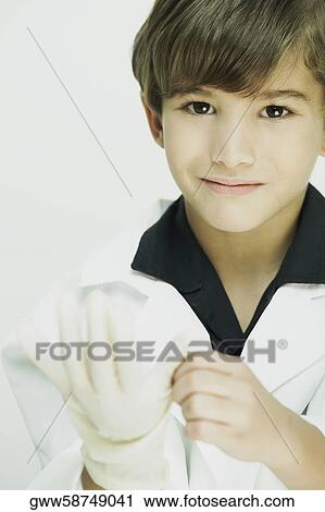 Stock Image - Portrait of a boy dressed as a doctor. Fotosearch