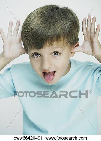 Portrait of a boy making a face View Large Photo Image Stock Image - Portrait of a boy making a face. Fotosearch