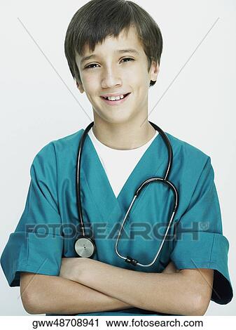 Stock Image - Portrait of a boy with a stethoscope around her neck and smiling. Fotosearch