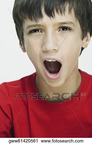 Portrait of a boy yawning View Large Photo Image Stock Image - Portrait of a boy yawning. Fotosearch