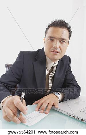 Portrait of a businessman holding a pen and a check View Large Photo Image Stock Image - Portrait of a businessman holding a pen and a check. Fotosearch