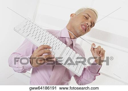Portrait of a businessman using a computer cable as a noose View Large Photo Image Stock Image - Portrait of a businessman using a computer cable as a noose. Fotosearch