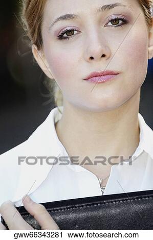 Portrait of a businesswoman holding a file View Large Photo Image Stock Image - Portrait of a businesswoman holding a file. Fotosearch