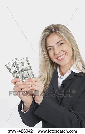 Portrait of a businesswoman holding American paper currency View Large Photo Image Stock Image - Portrait of a businesswoman holding American paper currency. Fotosearch