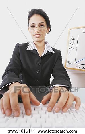 Portrait of a businesswoman using a computer keyboard View Large Photo Image Stock Image - Portrait of a businesswoman using a computer keyboard. Fotosearch