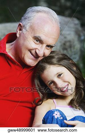 Portrait of a girl and her grandfather smiling View Large Photo Image Stock Image - Portrait of a girl and her grandfather smiling. Fotosearch