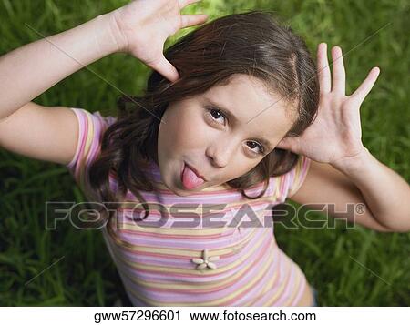Portrait of a girl making a face View Large Photo Image Stock Image - Portrait of a girl making a face. Fotosearch