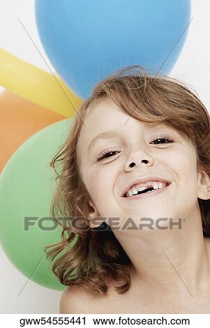 Stock Image - Portrait of a girl smiling. Fotosearch