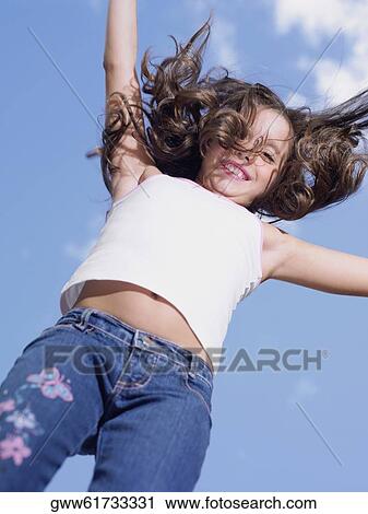 Stock Image - Portrait of a girl smiling. Fotosearch
