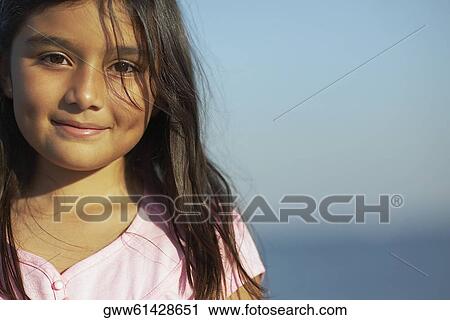 Portrait of a girl smirking View Large Photo Image Stock Image - Portrait of a girl smirking. Fotosearch