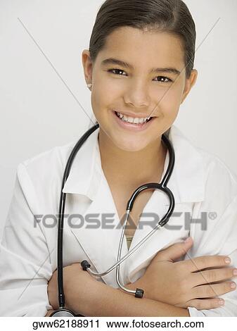 Stock Image - Portrait of a girl with a stethoscope around her neck. Fotosearch