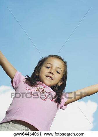 Portrait of a girl with her arms raised View Large Photo Image Stock Image - Portrait of a girl with her arms raised. Fotosearch