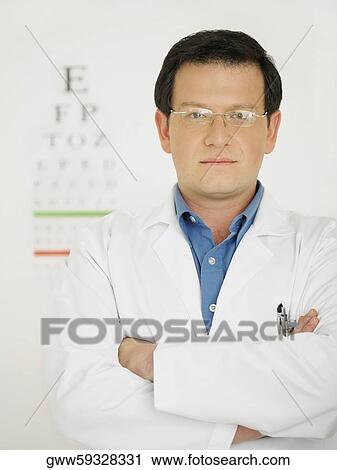 Stock Image - Portrait of a male doctor looking serious. Fotosearch