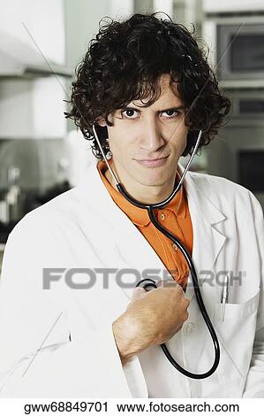 Portrait of a male doctor wearing a stethoscope View Large Photo Image Stock Image - Portrait of a male doctor wearing a stethoscope. Fotosearch
