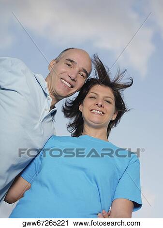 Portrait of a mature couple smiling View Large Photo Image Stock Image - Portrait of a mature couple smiling. Fotosearch