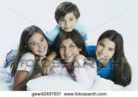 Portrait of a mature woman with her two daughters and son View Large Photo Image Stock Image - Portrait of a mature woman with her two daughters and son. Fotosearch