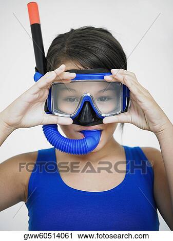 Portrait of a teenage girl adjusting the snorkel on her face View Large Photo Image Stock Image - Portrait of a teenage girl adjusting the snorkel on her face. Fotosearch