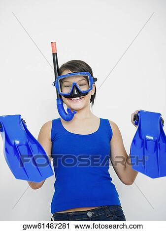 Portrait of a teenage girl smiling with a snorkel on her face and holding flippers View Large Photo Image Stock Image - Portrait of a teenage girl smiling with a snorkel on her face and holding flippers. Fotosearch