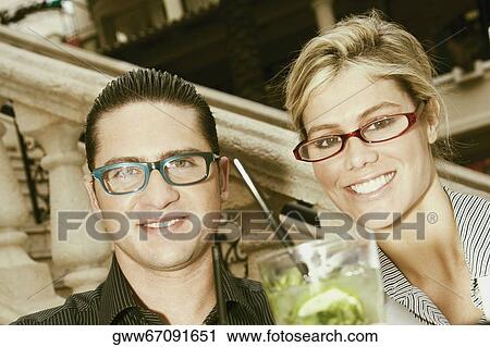 Portrait of a young couple smiling View Large Photo Image Stock Image - Portrait of a young couple smiling. Fotosearch