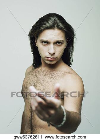 Portrait of a young man gesturing View Large Photo Image Stock Image - Portrait of a young man gesturing. Fotosearch
